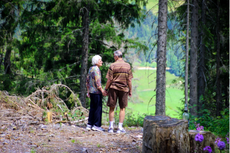 couple holding hands on a trail